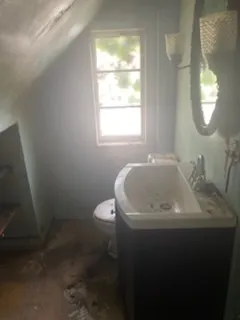 a bathroom with a shower and a mirror