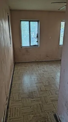 a view of an empty room with a window