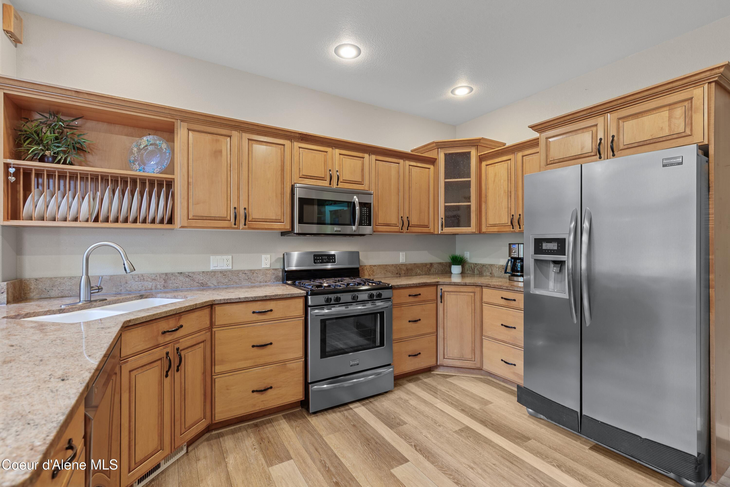8677 North Rhapsody Lane Hayden, ID 83835 - Photo 12 of 60 Bright & Functional Kitchen