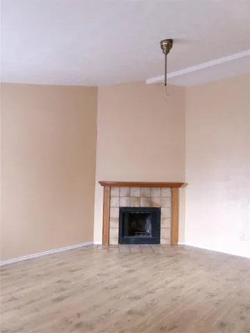 a room with a fireplace and a fireplace