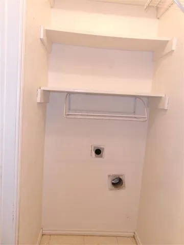 a view of a room with racks on the wall