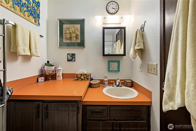a bathroom with a sink and a mirror
