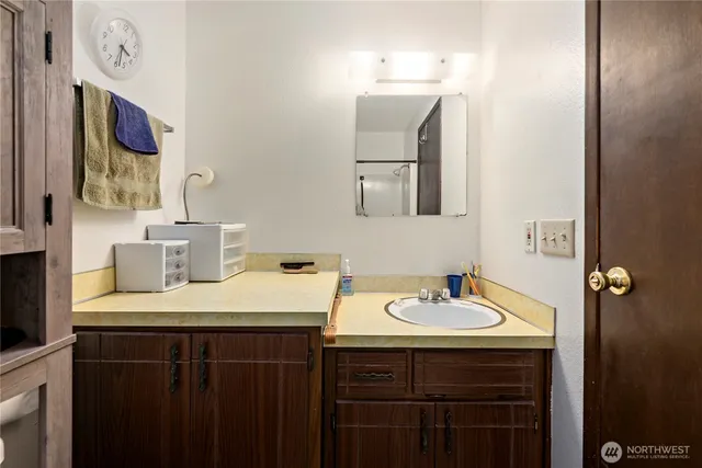 a bathroom with a sink and a mirror