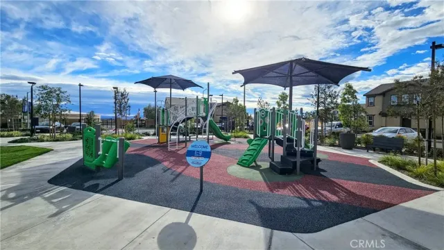 a view of a table and chairs under an umbrella
