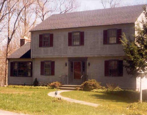 76 Standish Drive Ridgefield, CT 06877 - Photo 1 of 1 a front view of a house with a yard