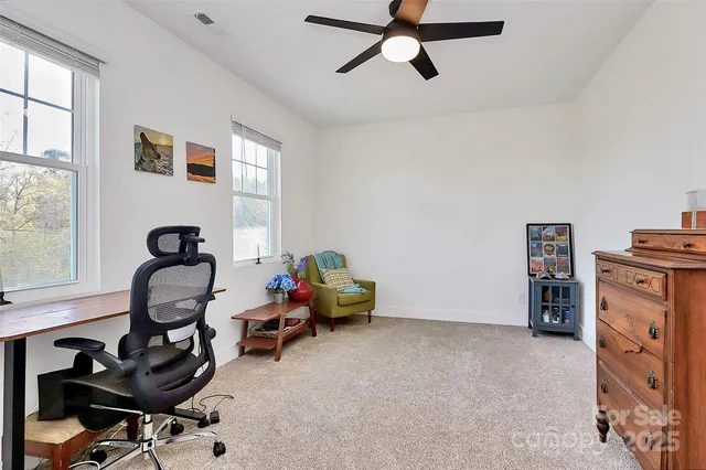 a bedroom with furniture and a window