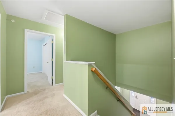 a view of a hallway with an empty room
