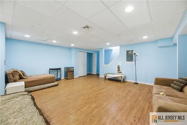 a bedroom with a bed and a couch