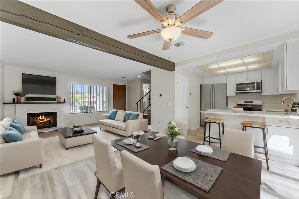 885 Via Sierra Nevada Riverside, CA 92507 - Photo 1 of 1 a living room with furniture a fireplace and a flat screen tv