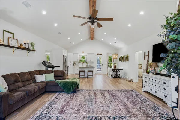 a living room with furniture and a flat screen tv
