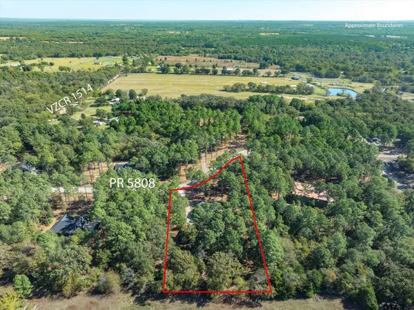 a view of mountains and green space