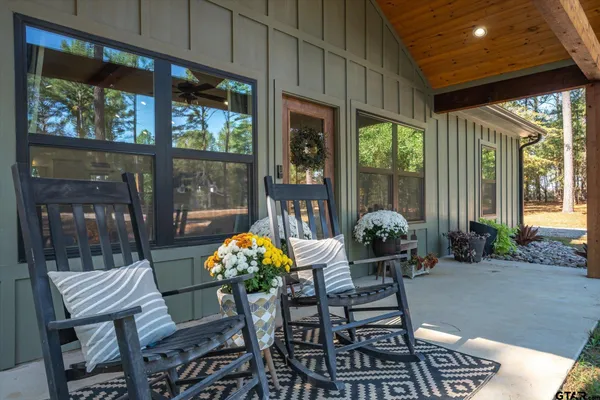 a dining room with furniture wooden floor and a potted plant