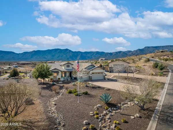 a view of a lake with beach and mountain view