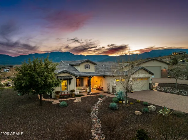 a view of living room filled with furniture and window