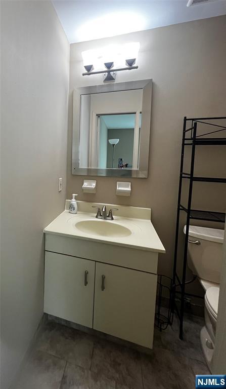 34 Riverview Court, Unit 34 Secaucus, NJ 07094 - Photo 14 of 16 a bathroom with a sink vanity and toilet