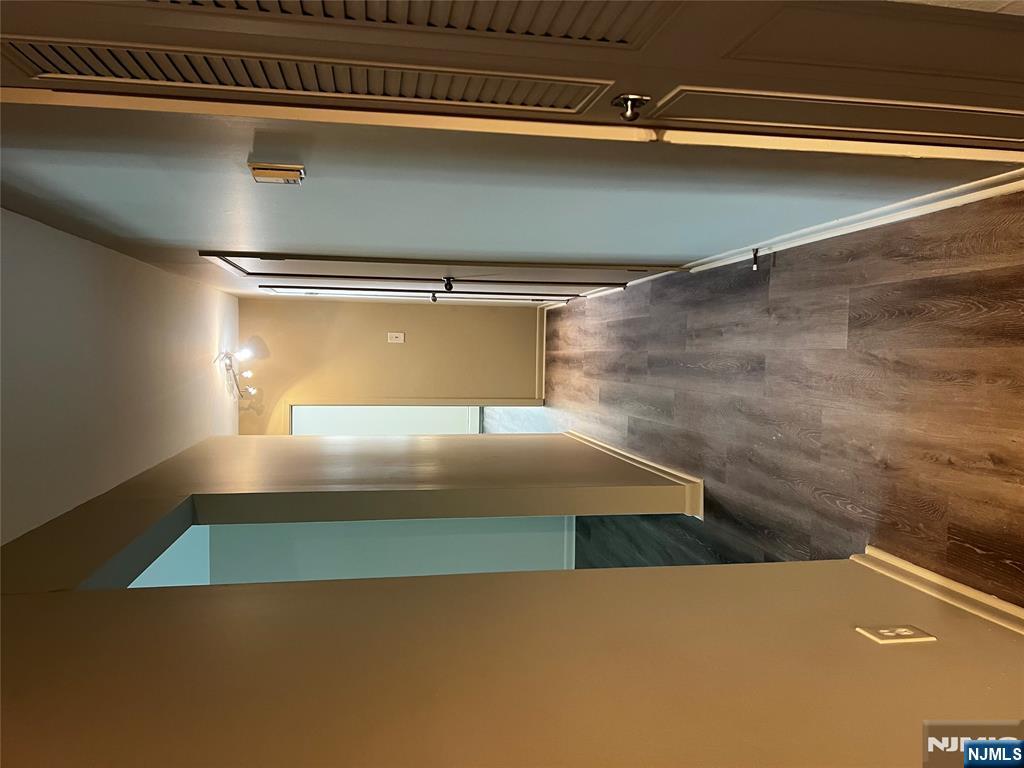 34 Riverview Court, Unit 34 Secaucus, NJ 07094 - Photo 8 of 16 a view of a hallway with wooden floor