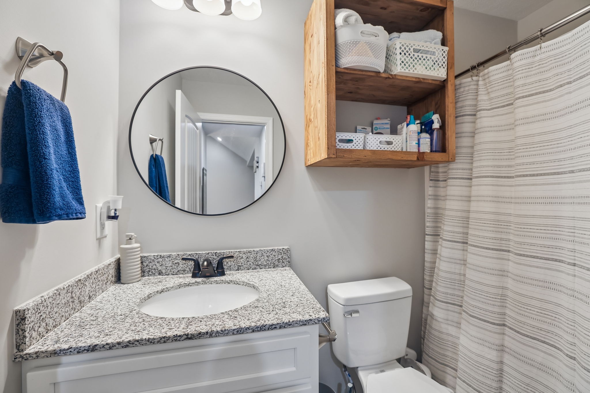 1715 Old Belfast Road Lewisburg, TN 37091 - Photo 28 of 42 a bathroom with a granite countertop toilet a sink and a mirror