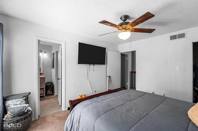 a room with a bed and a mirror