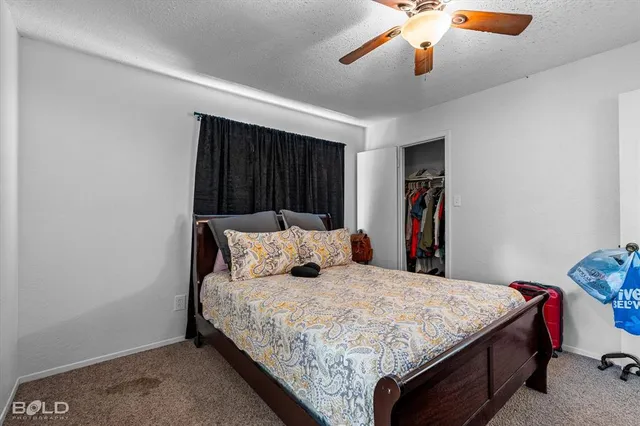 a bedroom with a bed and a walk in closet