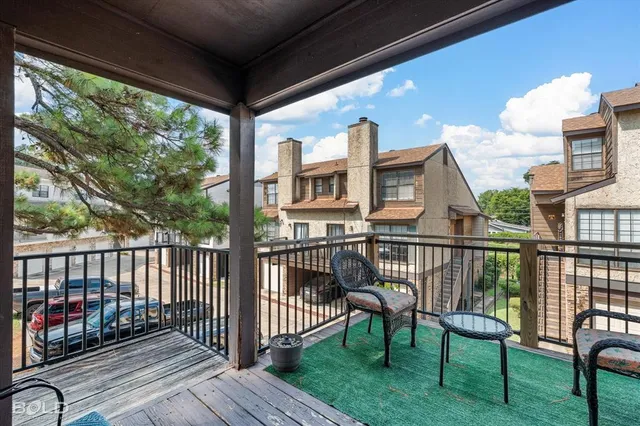 a view of a two chairs in the patio