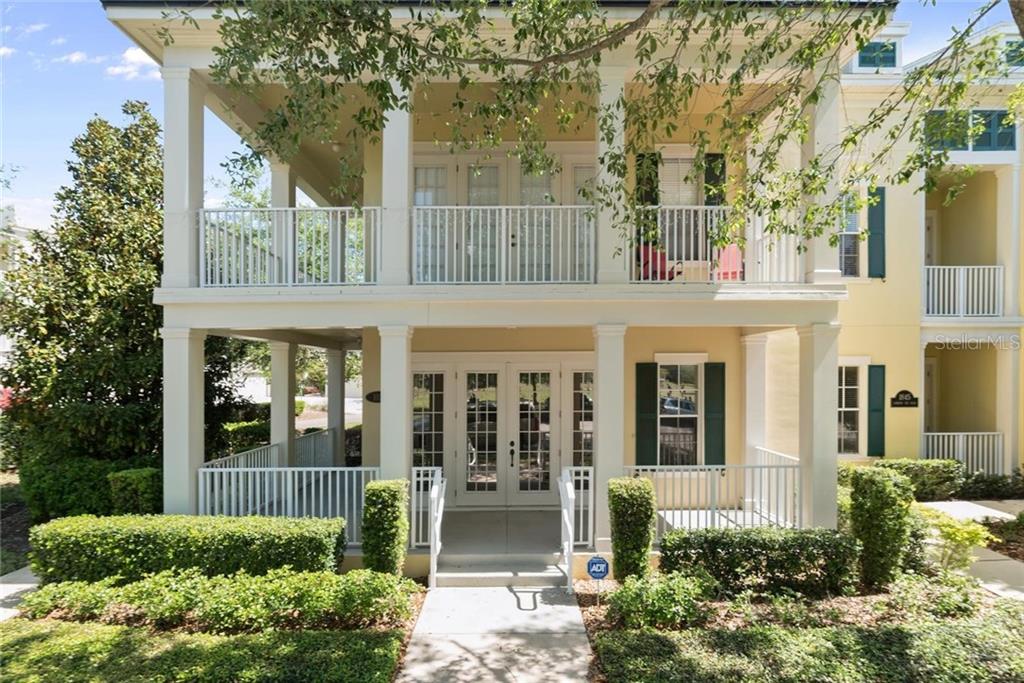 1845 Common Way Road, Unit 103 Orlando, FL 32814 - Photo 1 of 1 front view of a house with a garden