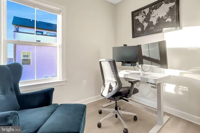 a work room with furniture and window