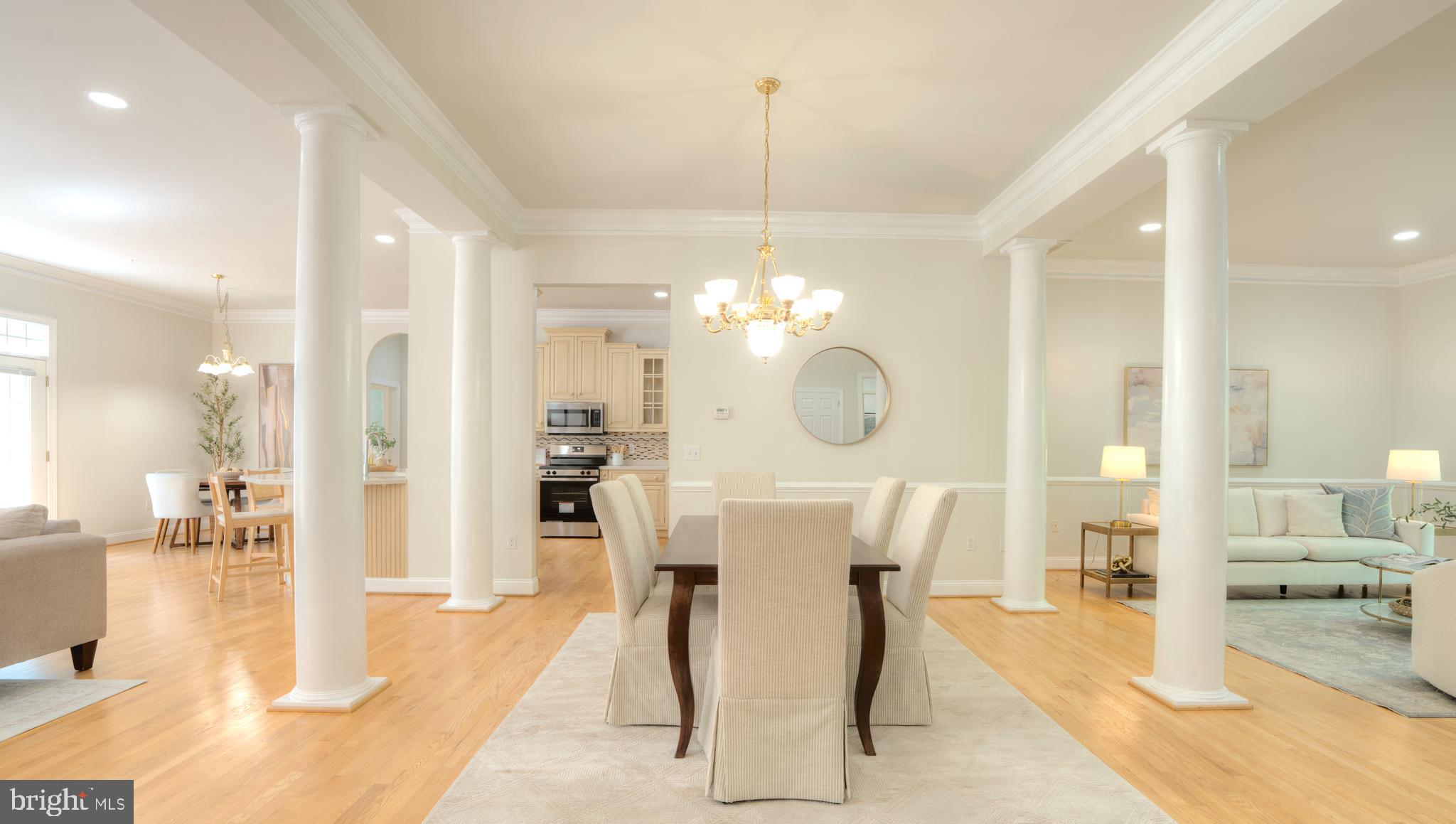 4300 Pinetree Road Rockville, MD 20853 - Photo 13 of 50 a view of a dining hall with a dining table chairs and couches with wooden floor