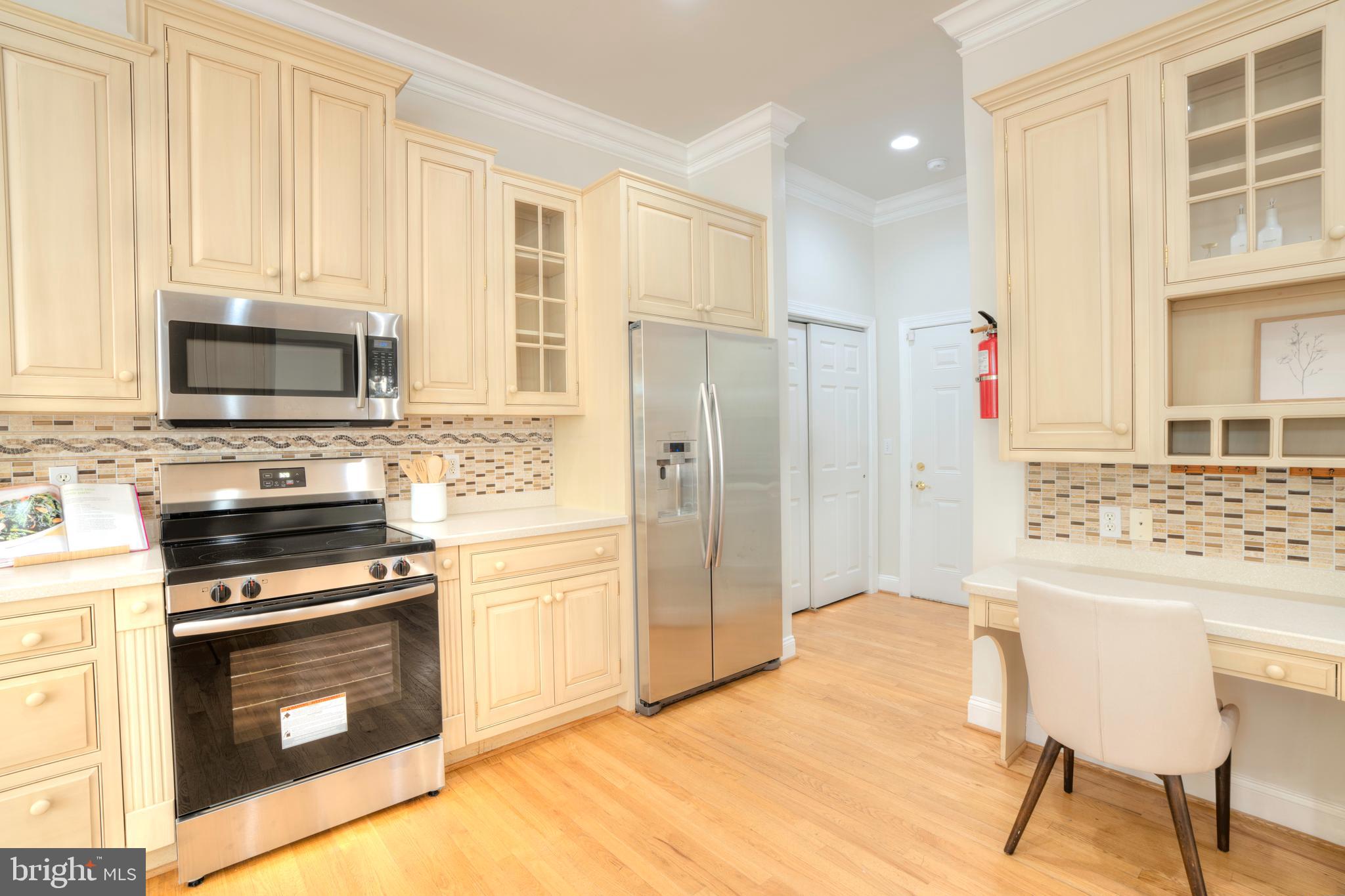 4300 Pinetree Road Rockville, MD 20853 - Photo 30 of 50 a kitchen with stainless steel appliances a stove microwave and refrigerator