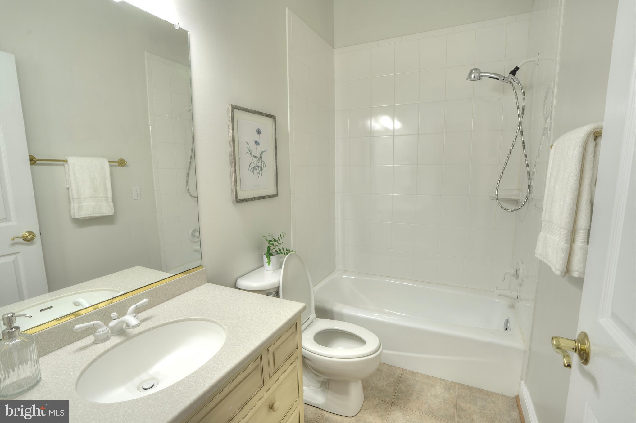 4300 Pinetree Road Rockville, MD 20853 - Photo 33 of 50 a bathroom with a sink toilet and shower