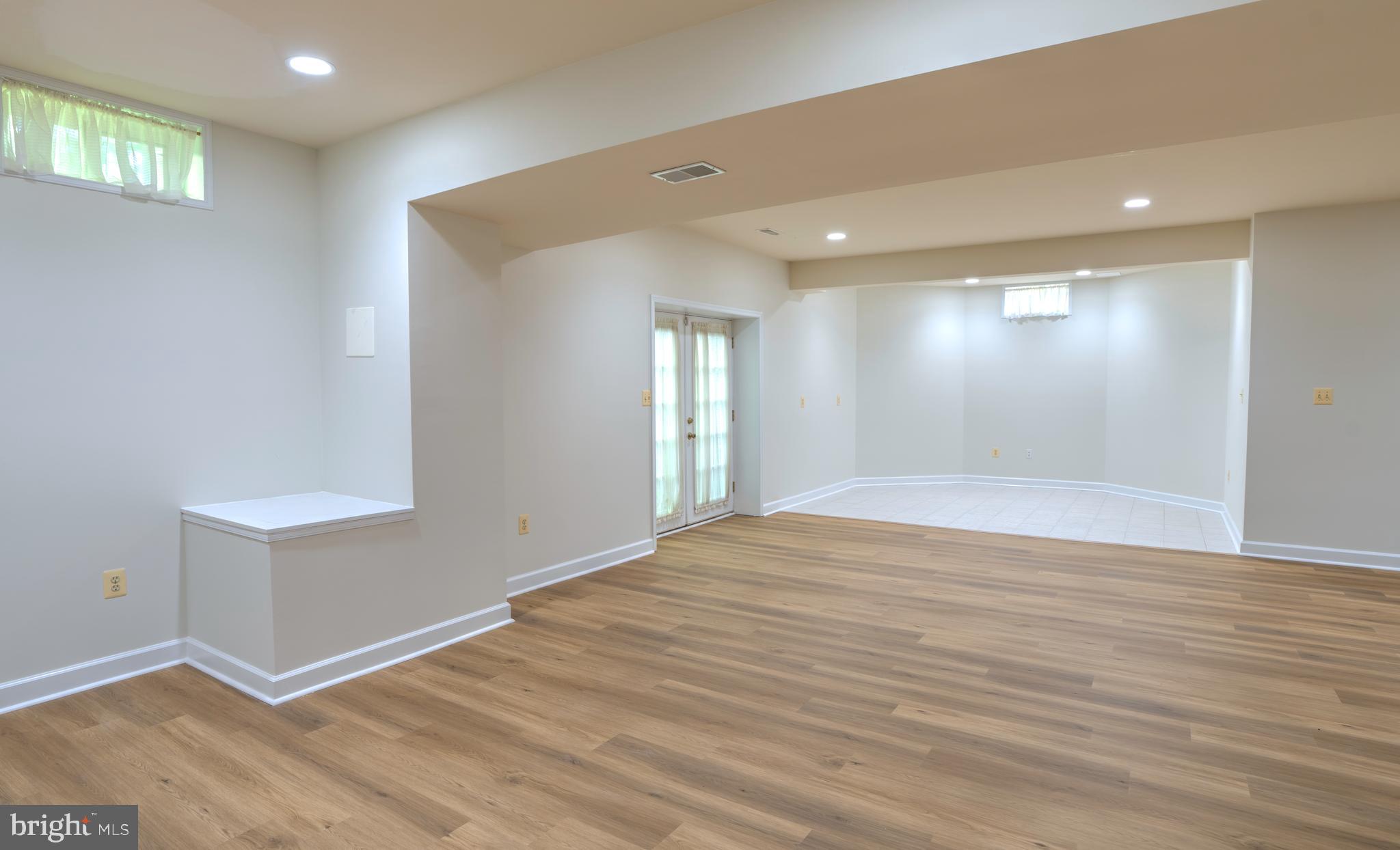 4300 Pinetree Road Rockville, MD 20853 - Photo 42 of 50 a view of empty room with wooden floor and fan