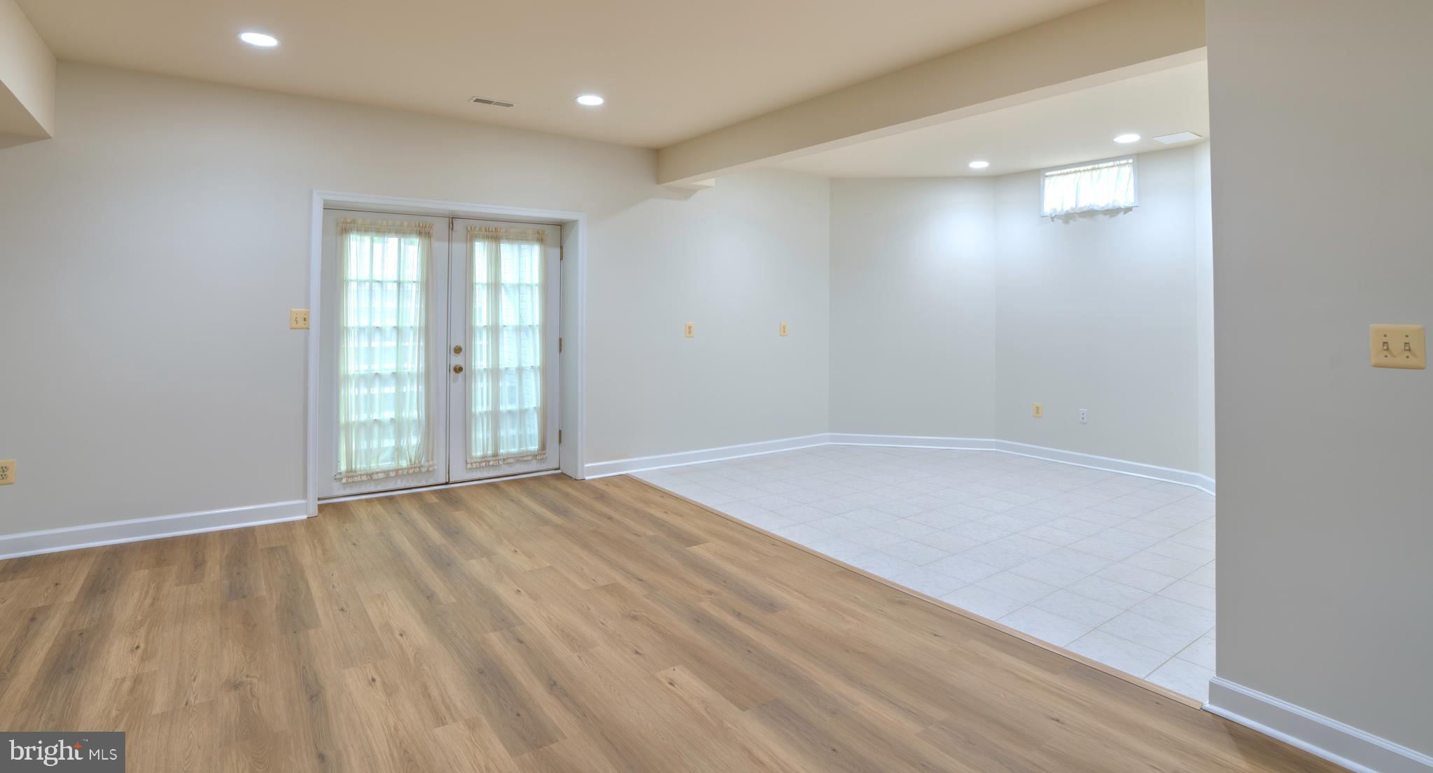 4300 Pinetree Road Rockville, MD 20853 - Photo 43 of 50 a view of an empty room with wooden floor and a window