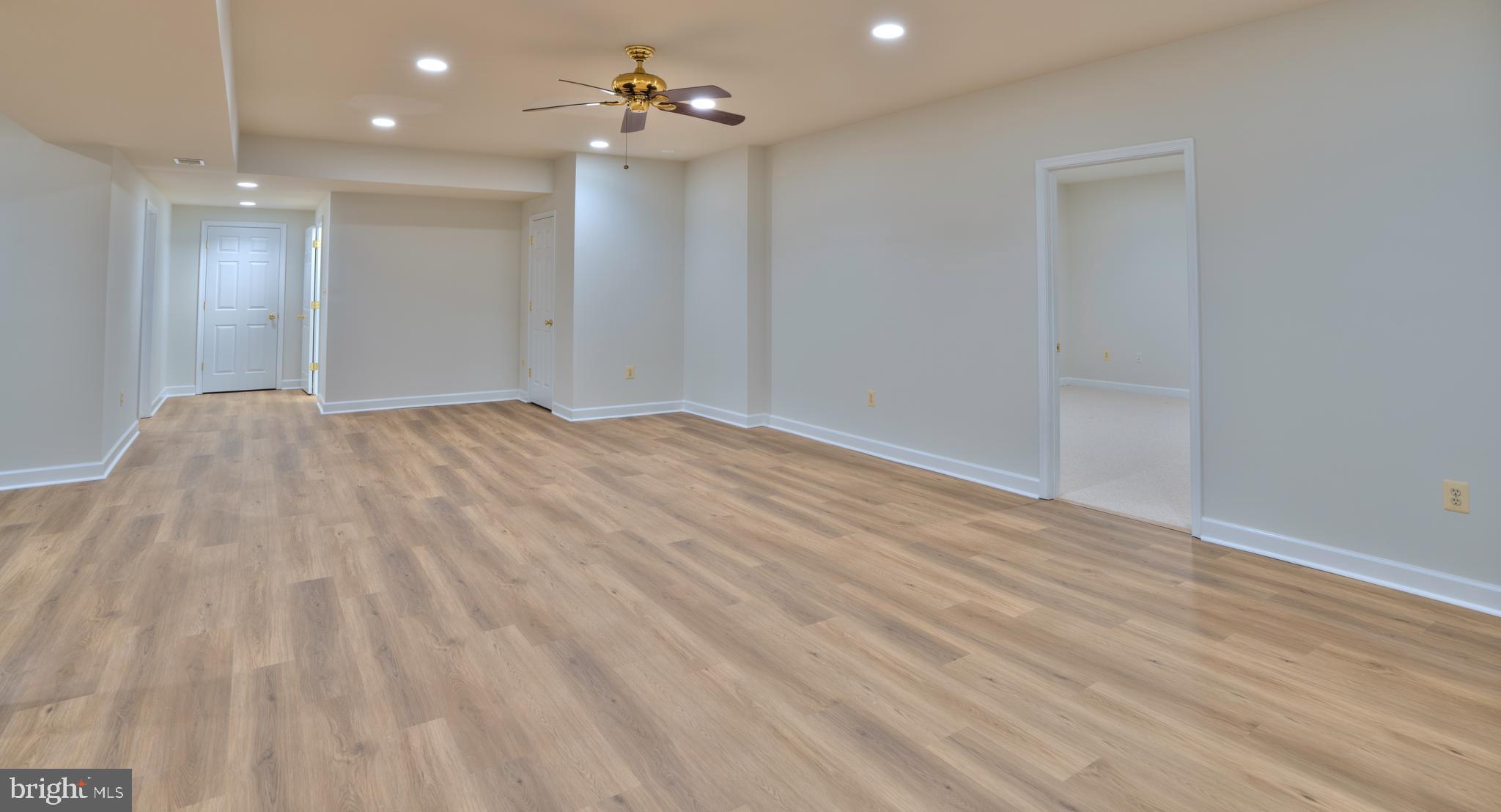4300 Pinetree Road Rockville, MD 20853 - Photo 44 of 50 a view of empty room with wooden floor and fan