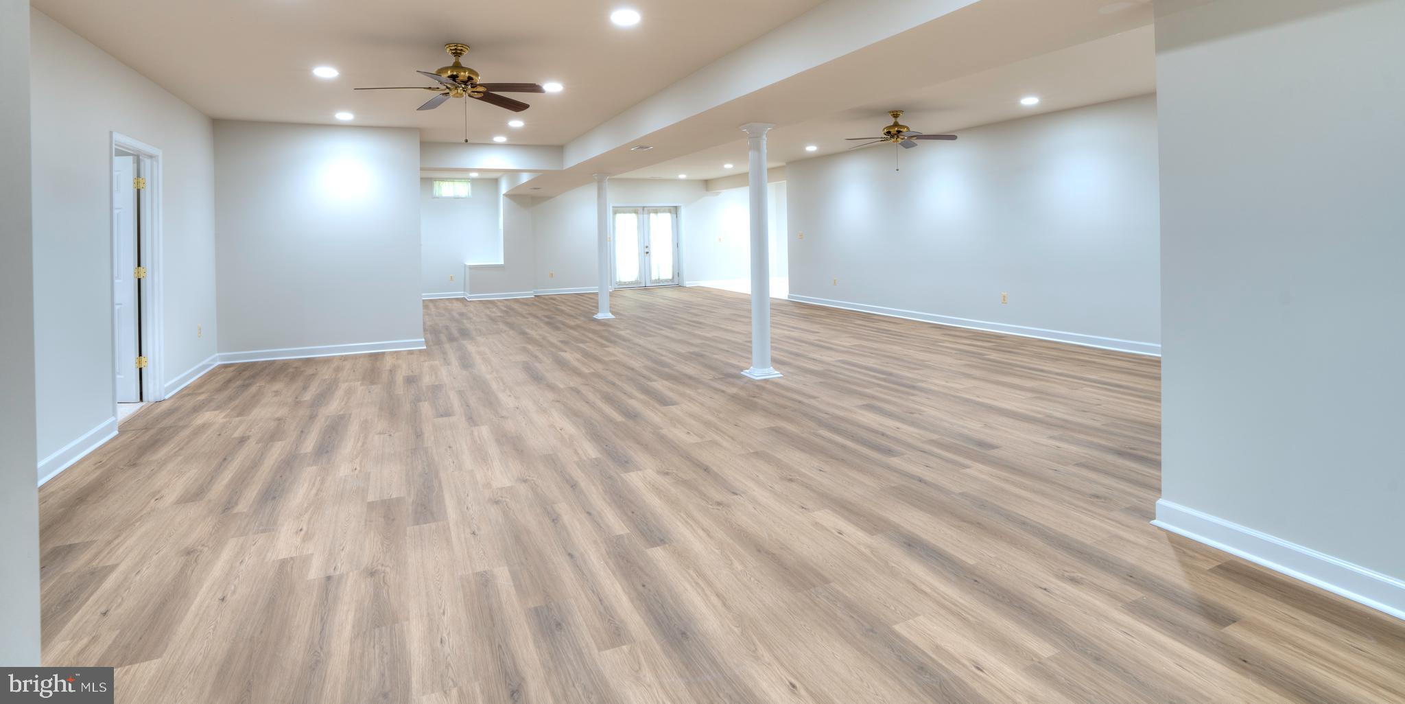 4300 Pinetree Road Rockville, MD 20853 - Photo 45 of 50 an empty room with wooden floor and windows