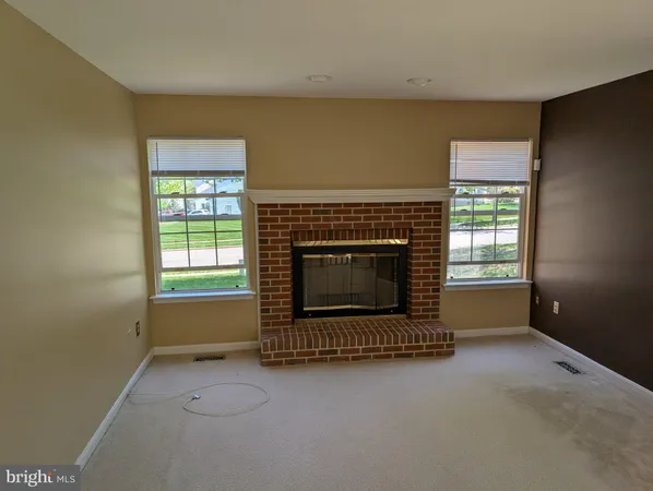 a living room with a fireplace