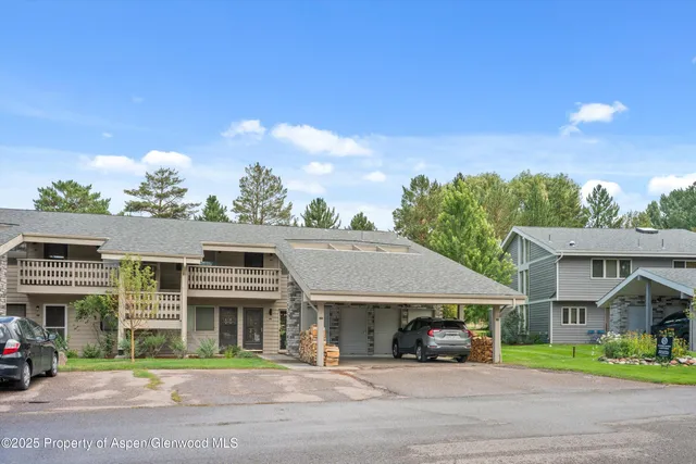 a view of street along with houses