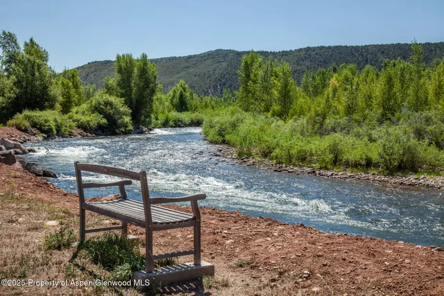 a view of a bench in a backyard