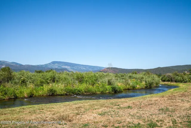 a view of mountain with lake view