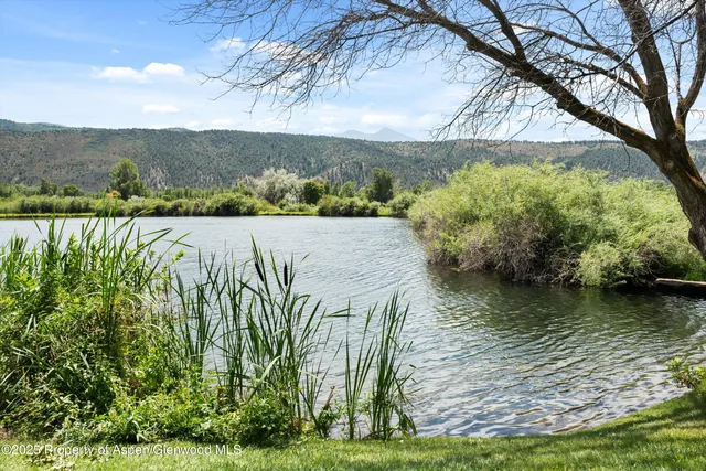 a view of a lake with a mountain in the background