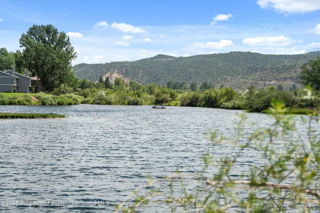 a view of a lake with mountain
