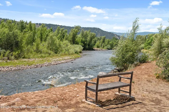 a view of a bench in a backyard