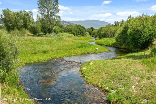 a view of a road with a yard
