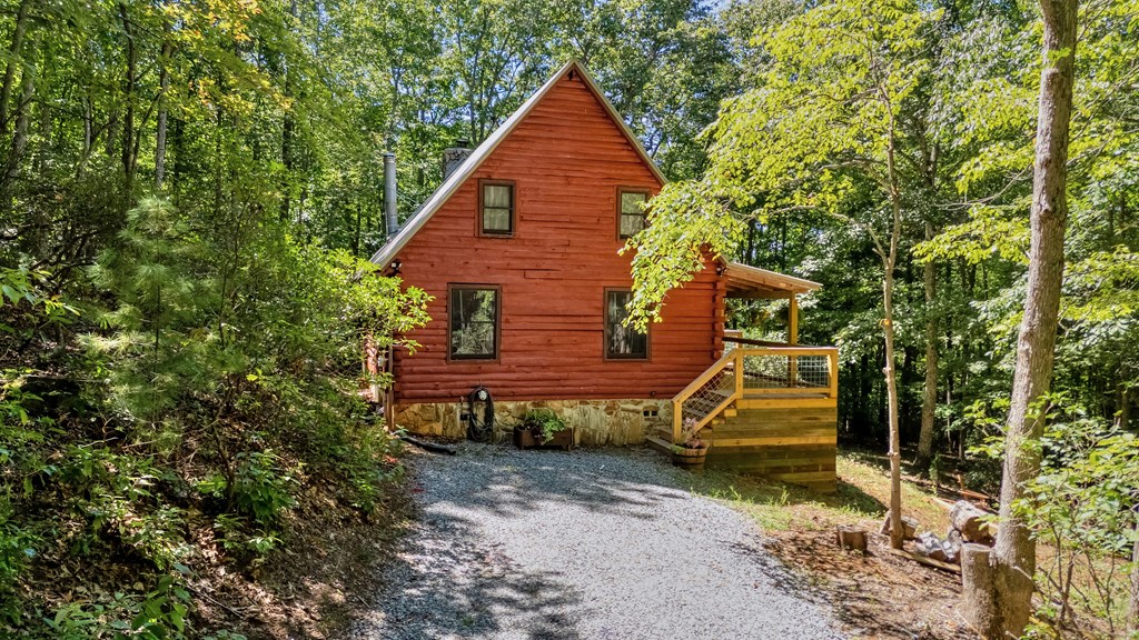 84 Knights Way Blairsville, GA 30512 - Photo 13 of 51 a backyard of a house with a table and chairs