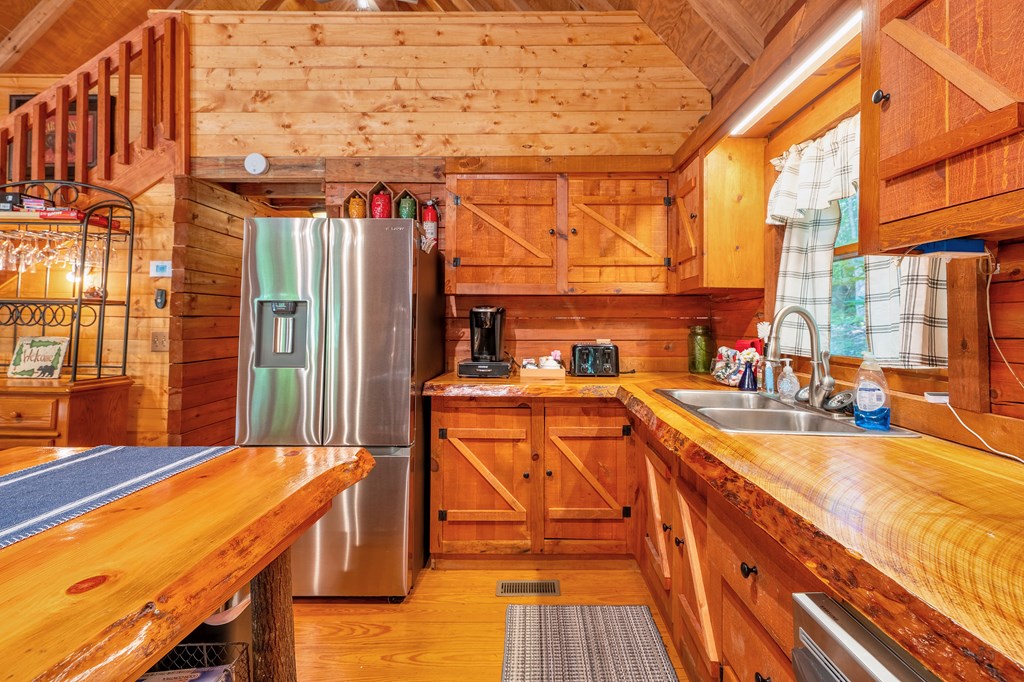 84 Knights Way Blairsville, GA 30512 - Photo 15 of 51 a view of a balcony with wooden floor and outdoor seating