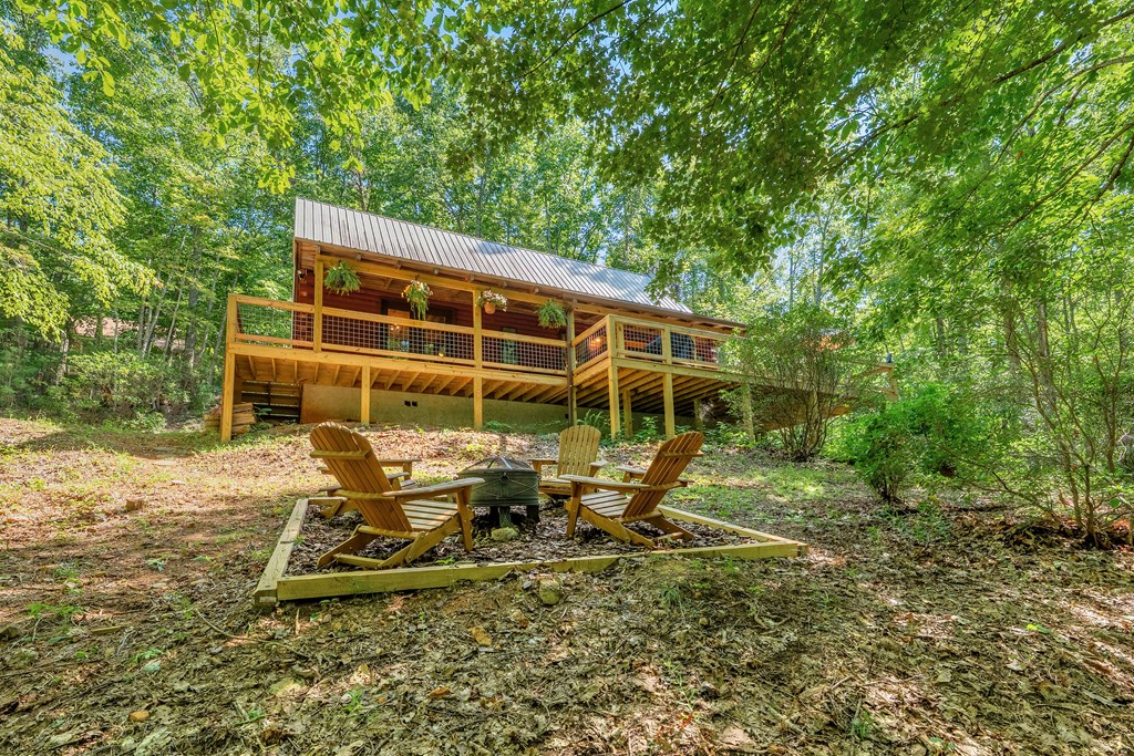 84 Knights Way Blairsville, GA 30512 - Photo 18 of 51 a view of backyard with deck and garden
