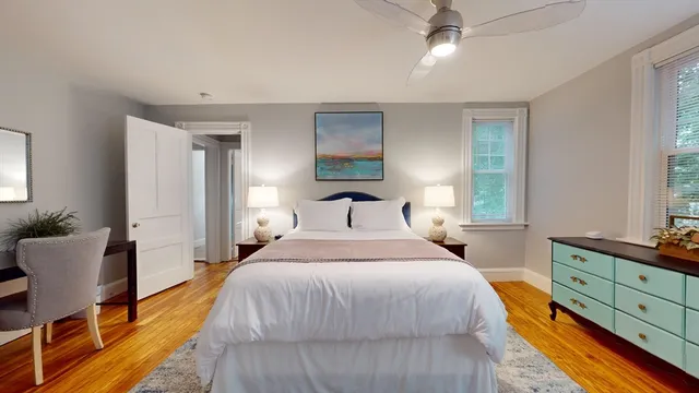 a bedroom with a bed and window