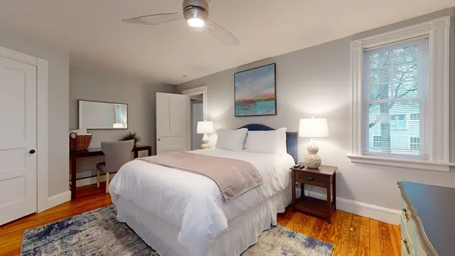 a bed room with a bed and a tv