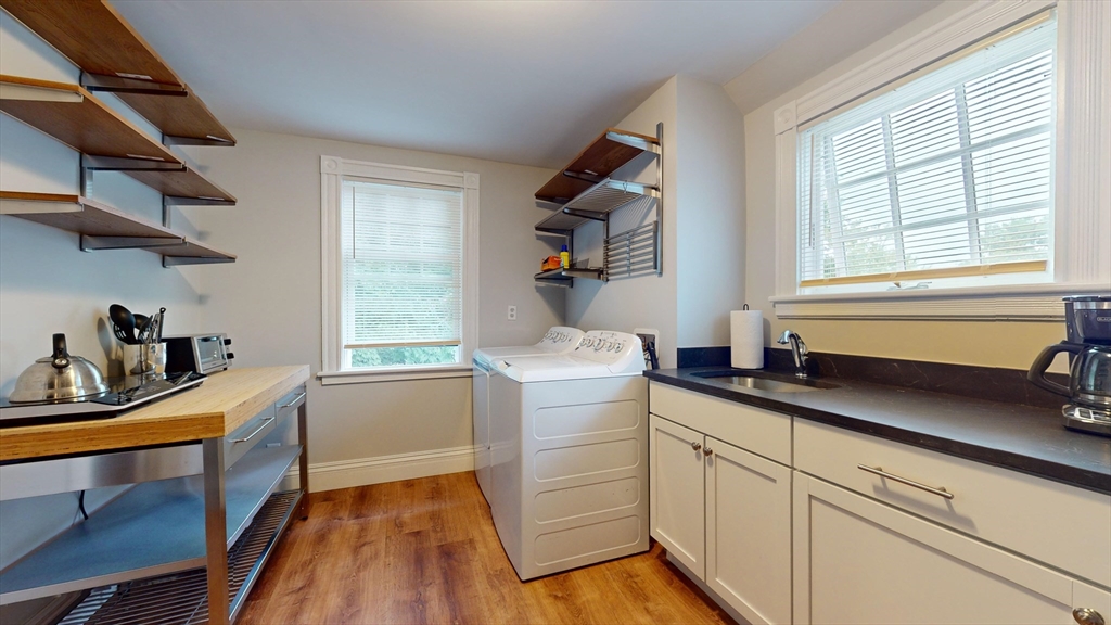 16 Linder Terrace, Unit 2 Newton, MA 02458 - Photo 10 of 22 a kitchen with a sink stove and cabinets