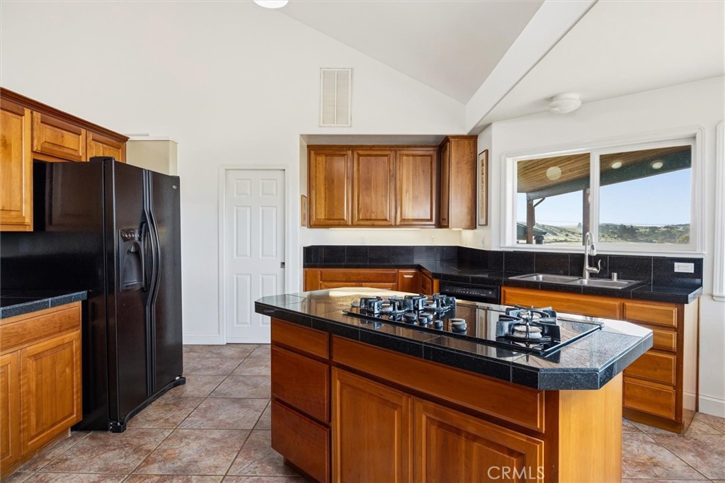 1985 Penman Springs Road Paso Robles, CA 93446 - Photo 15 of 65 a kitchen with stainless steel appliances granite countertop a sink stove and refrigerator