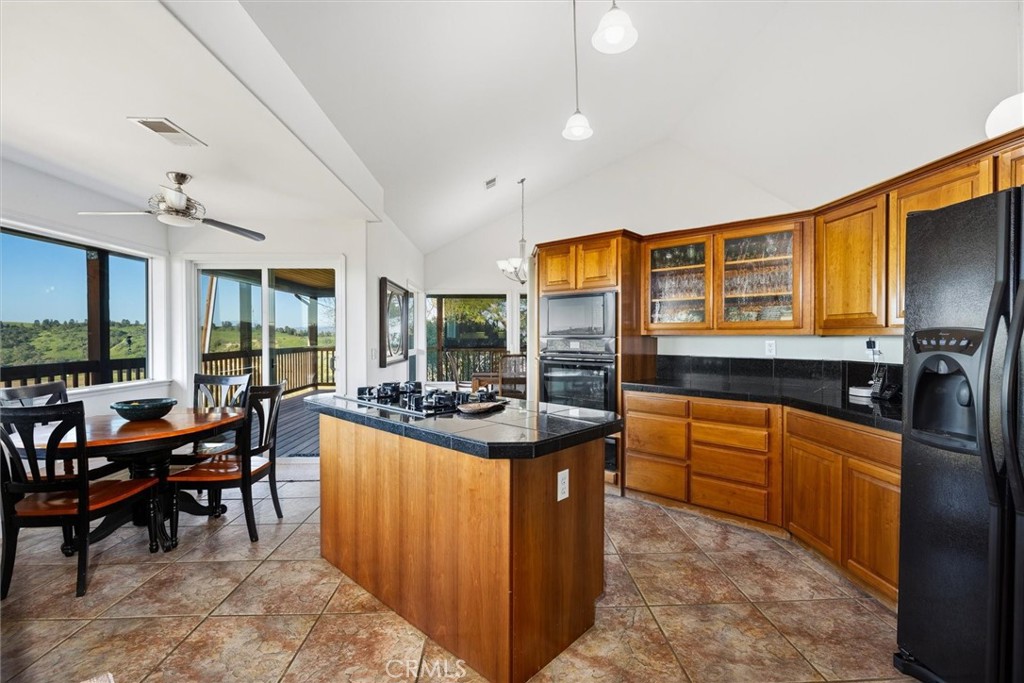 1985 Penman Springs Road Paso Robles, CA 93446 - Photo 16 of 65 a kitchen with stainless steel appliances granite countertop a stove and a sink