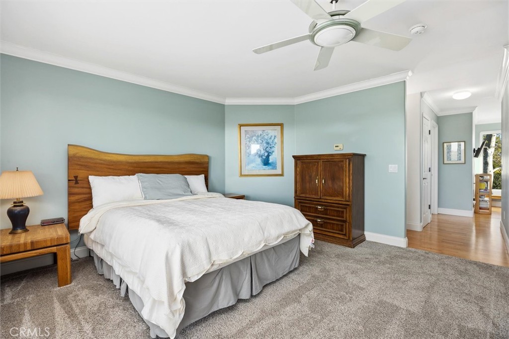 1985 Penman Springs Road Paso Robles, CA 93446 - Photo 19 of 65 a bedroom with a bed and a chandelier